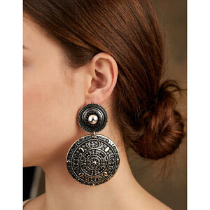Vtg clip-on statement earrings featuring intricate filigree and medallion design
